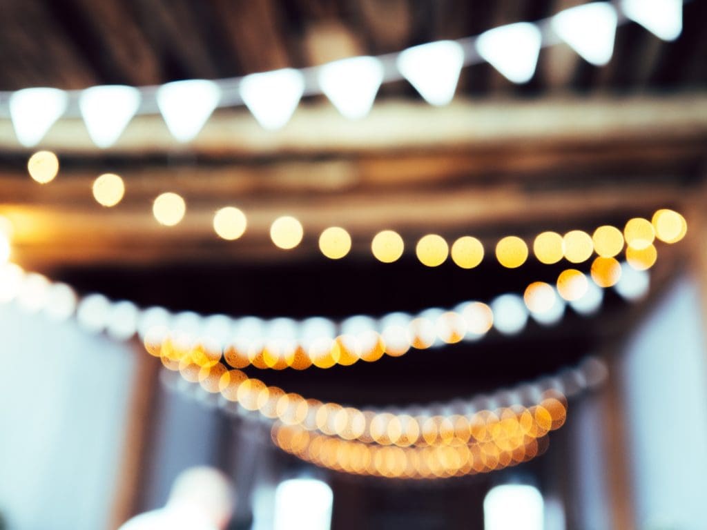 blurry lights at a wedding, wedding insurance tips